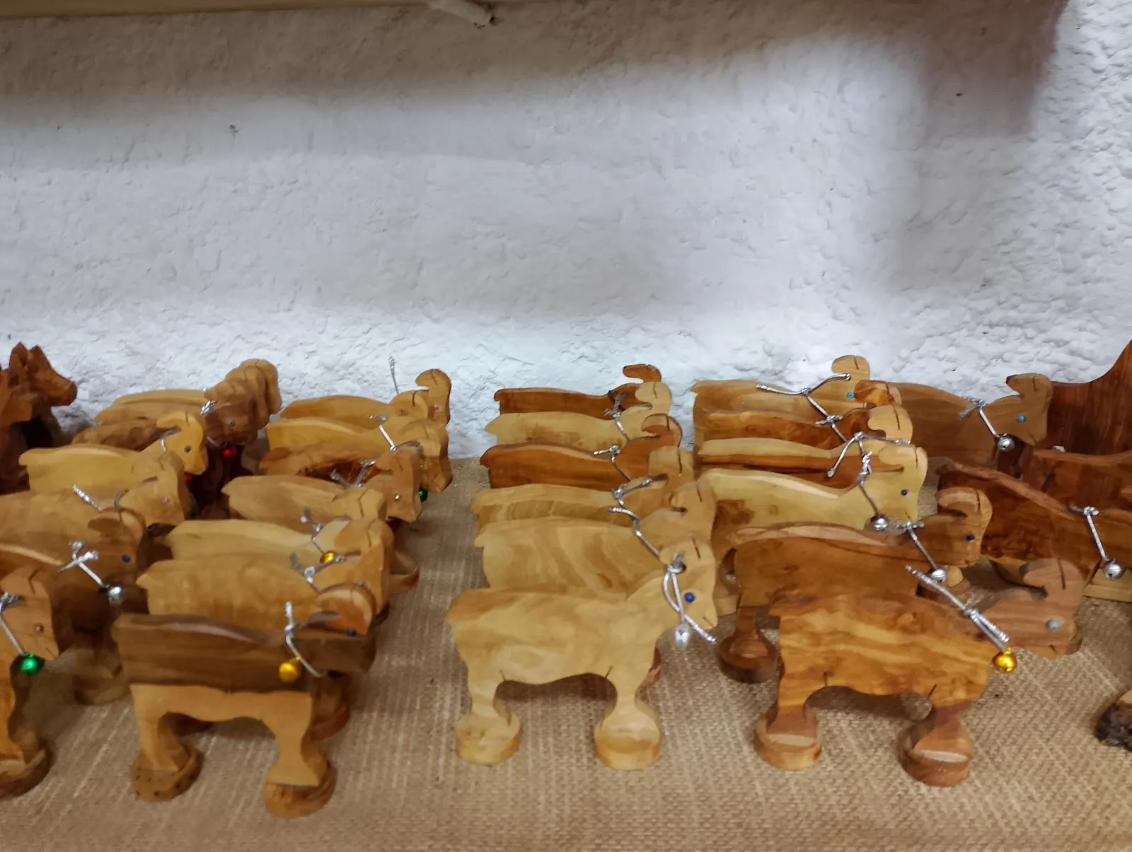 A table of carved olive wood pieces